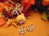 KJL Rhinestone Bow Brooch and Clip Earring Set - 1980s