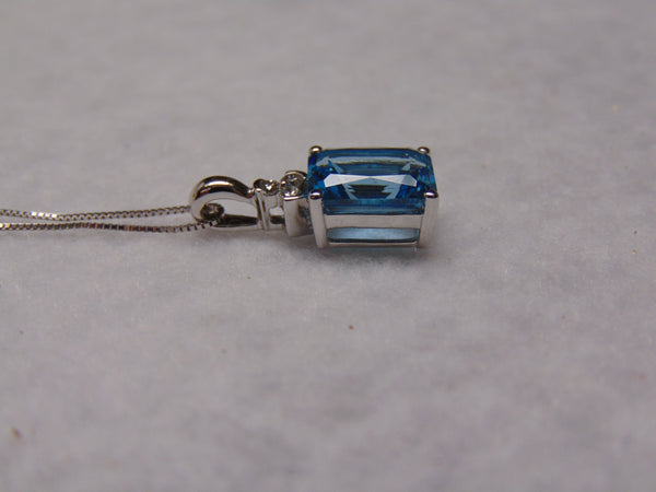 14KTWG Blue Topaz Necklace: Emerald Cut Diamond Accent