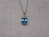 14KTWG Blue Topaz Necklace: Emerald Cut Diamond Accent