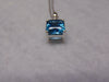 14KTWG Blue Topaz Necklace: Emerald Cut Diamond Accent