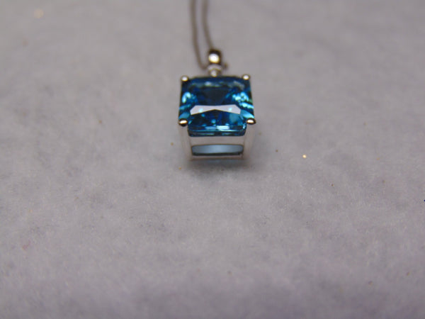 14KTWG Blue Topaz Necklace: Emerald Cut Diamond Accent