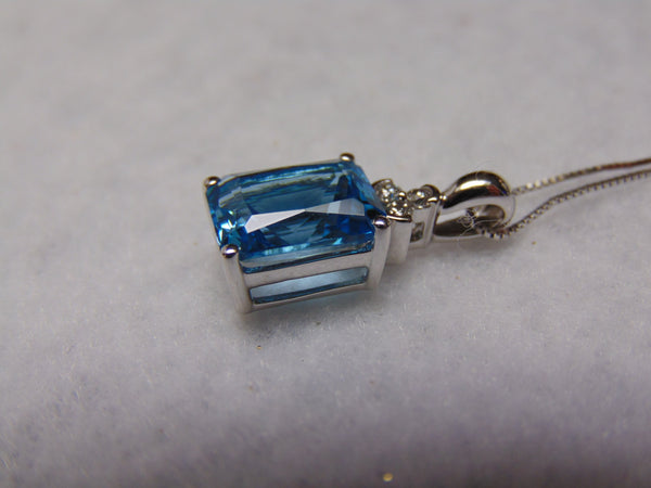 14KTWG Blue Topaz Necklace: Emerald Cut Diamond Accent