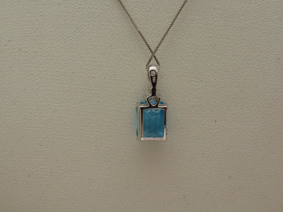 14KTWG Blue Topaz Necklace: Emerald Cut Diamond Accent