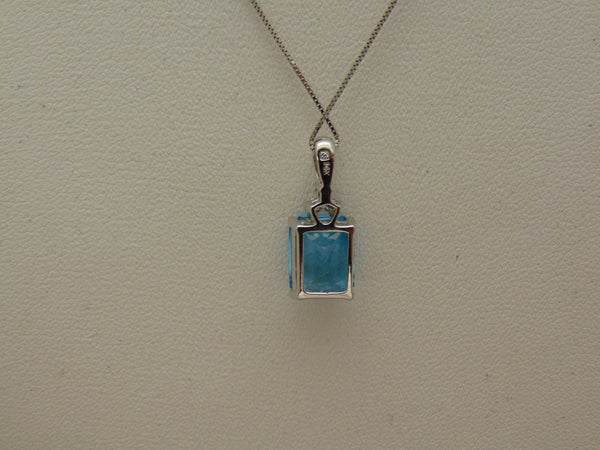 14KTWG Blue Topaz Necklace: Emerald Cut Diamond Accent