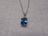 14KTWG Blue Topaz Necklace: Emerald Cut Diamond Accent