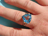 14KT White Gold Blue Topaz Ring with Champagne Diamonds