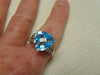 14KT White Gold Blue Topaz Ring with Champagne Diamonds
