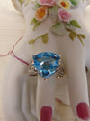14KT White Gold Blue Topaz Ring with Champagne Diamonds