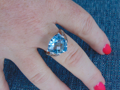 14KT White Gold Blue Topaz Ring with Champagne Diamonds